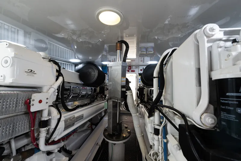 Slide: The Image of Engine room of a 2014 Viking 70C yacht, showcasing mechanical components and systems. - 80
