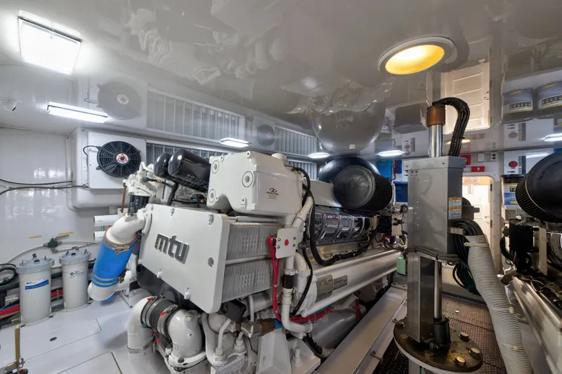 Slide: The Image of Engine room of a 2014 Viking 70C yacht featuring MTU engines and advanced machinery. - 78