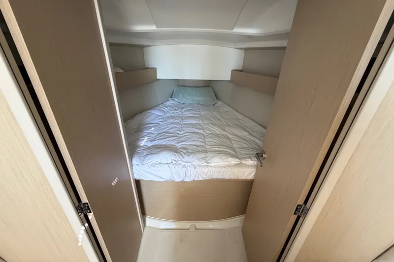 Slide: The Image of Cozy cabin interior of 2021 Beneteau Oceanis 30.1 yacht with comfortable bedding. - 4