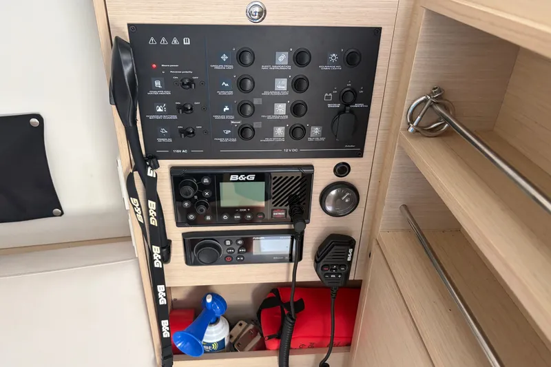 Slide: The Image of Control panel of a 2021 Beneteau Oceanis 30.1 sailboat with navigation equipment. - 6