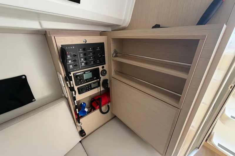 Slide: The Image of Control panel and storage in 2021 Beneteau Oceanis 30.1 yacht interior. - 5