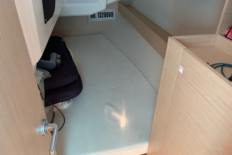 Slide: The Image of Interior cabin of 2021 Beneteau Oceanis 30.1 yacht, featuring a cozy sleeping area. - 22