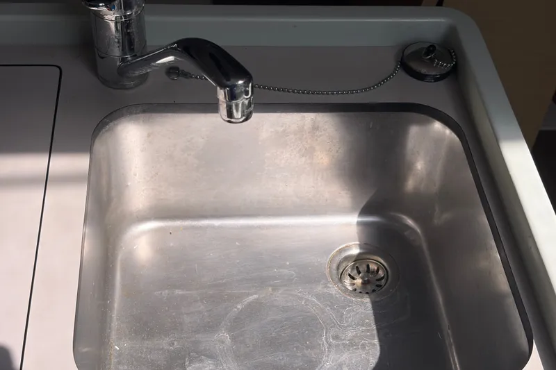 Slide: The Image of Stainless steel sink on 2021 Beneteau Oceanis 30.1 yacht, featuring modern faucet design. - 20