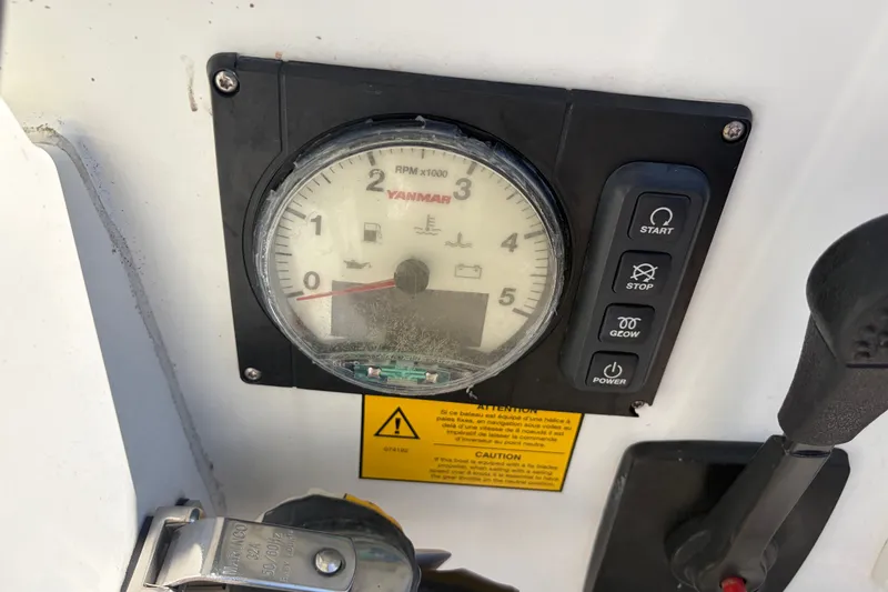 Slide: The Image of Yanmar engine control panel on a 2021 Beneteau Oceanis 30.1 sailboat. - 28