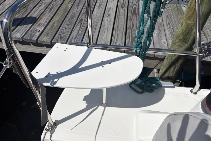Slide: The Image of Beneteau Oceanis 30.1 yacht deck detail with ropes and dock, 2021 model. - 30