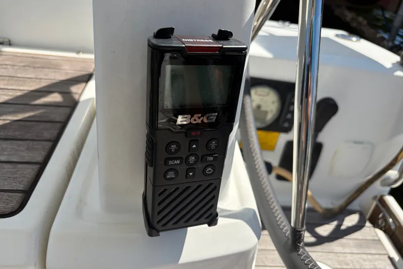 Slide: The Image of B&G marine radio on Beneteau Oceanis 30.1 yacht, 2021 model, with wooden deck background. - 26