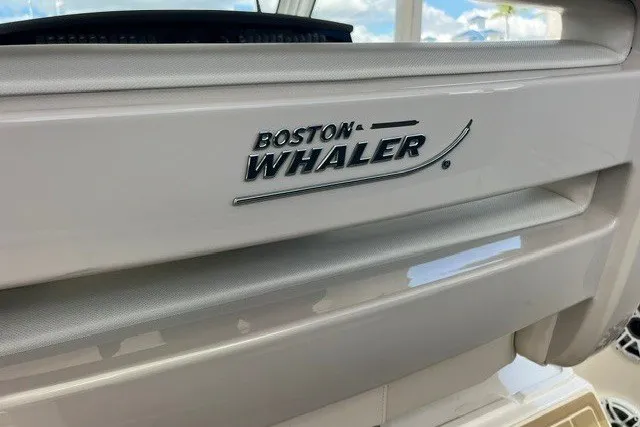 Slide: The Image of 2019 Boston Whaler 380 Realm boat logo on sleek white surface. - 30