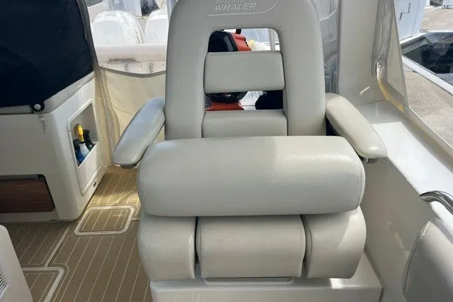 Slide: The Image of Luxury seating on a 2019 Boston Whaler 380 Realm boat, featuring plush white upholstery. - 18