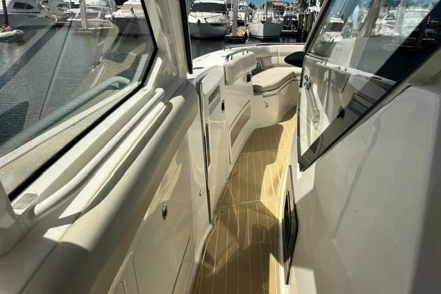 Slide: The Image of 2019 Boston Whaler 380 Realm boat interior with sleek design and spacious seating. - 27
