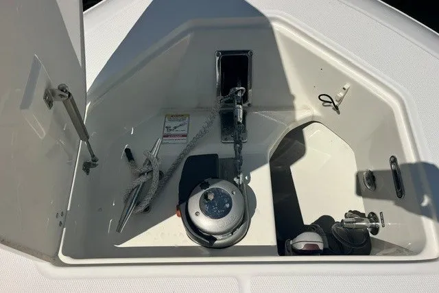 Slide: The Image of Anchor compartment of 2019 Boston Whaler 380 Realm boat, featuring anchor and chain storage. - 12