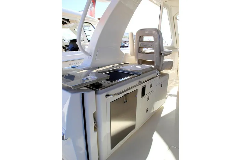 Slide: The Image of Manufacturer Provided Image: 2019 Boston Whaler 380 Realm boat interior with kitchenette and seating area. - 6