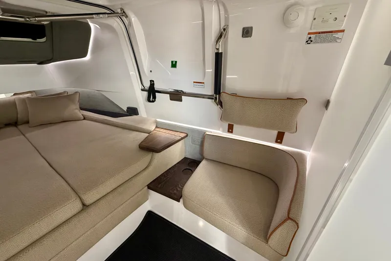 Slide: The Image of Luxurious interior of 2021 Axopar 37 XC Cross Cabin with beige seating and modern design. - 35