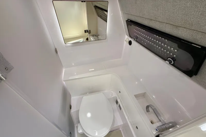 Slide: The Image of 2021 Axopar 37 XC Cross Cabin bathroom with modern fixtures and sleek design. - 33