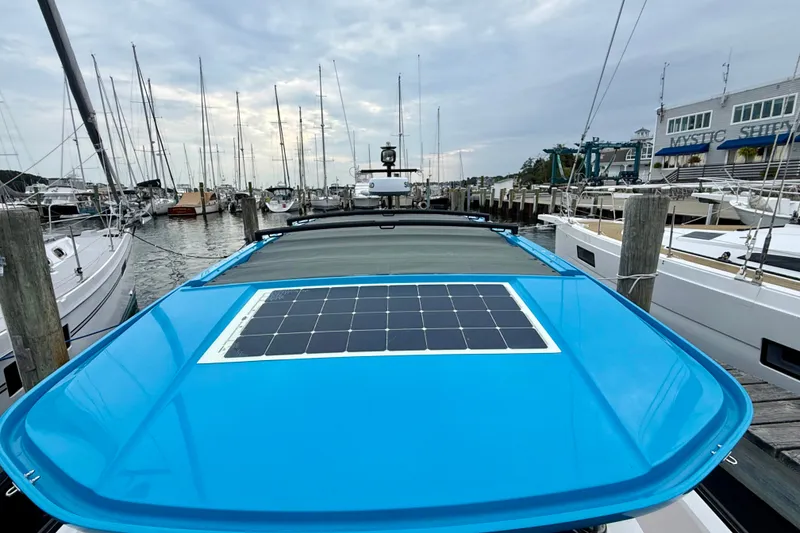 Slide: The Image of 2021 Axopar 37 XC Cross Cabin with solar panel, docked at marina. - 7