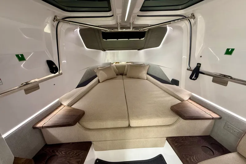 Slide: The Image of Interior cabin of 2021 Axopar 37 XC Cross Cabin with cozy bedding and modern design. - 34