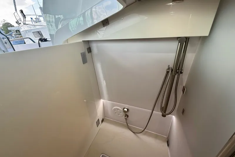 Slide: The Image of Shower area inside 2021 Axopar 37 XC Cross Cabin boat, featuring modern fixtures. - 32