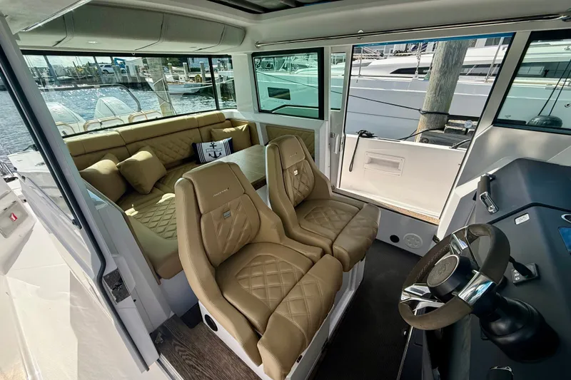 Slide: The Image of Luxurious interior of 2021 Axopar 37 XC Cross Cabin with plush seating and modern design. - 24