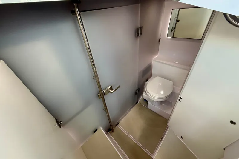 Slide: The Image of 2021 Axopar 37 XC Cross Cabin bathroom with modern fixtures and compact design. - 31