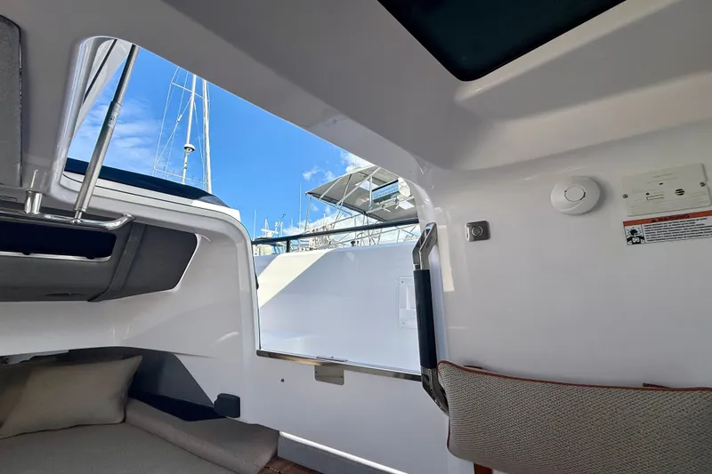 Slide: The Image of Interior view of 2021 Axopar 37 XC Cross Cabin, showcasing cabin details and open hatch. - 38