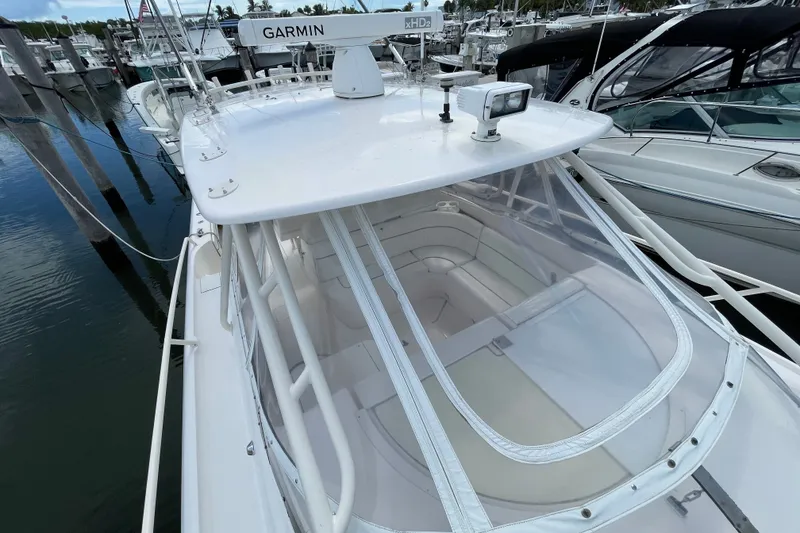 Slide: The Image of 2001 Intrepid 377 Walkaround boat with Garmin radar, docked in a marina. - 22