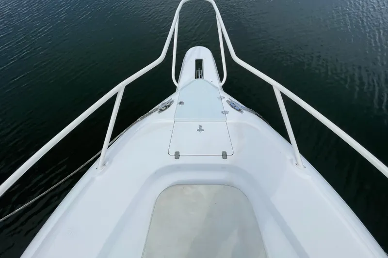 Slide: The Image of Bow view of 2001 Intrepid 377 Walkaround boat on calm water. - 16
