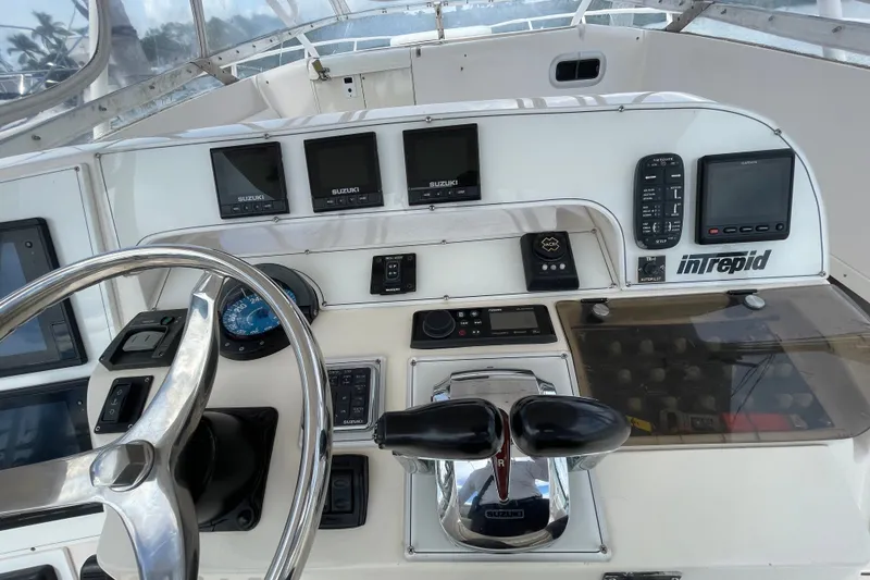 Slide: The Image of Control panel of a 2001 Intrepid 377 Walkaround boat with Suzuki displays. - 47