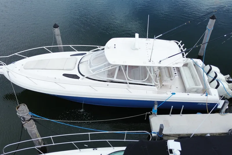 Slide: The Image of 2001 Intrepid 377 Walkaround boat docked at marina, aerial view. - 13