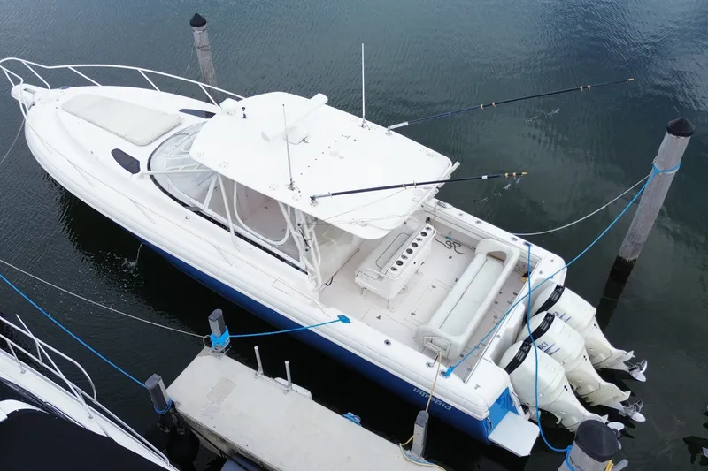 Slide: The Image of Aerial view of a 2001 Intrepid 377 Walkaround boat docked at a marina. - 50