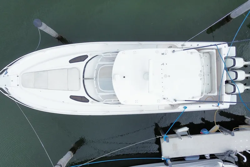 Slide: The Image of Overhead view of a 2001 Intrepid 377 Walkaround boat docked at a marina. - 55