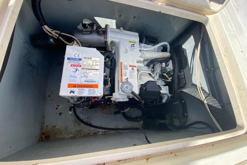 Slide: The Image of Engine compartment of a 2001 Intrepid 377 Walkaround boat, showcasing mechanical components. - 42