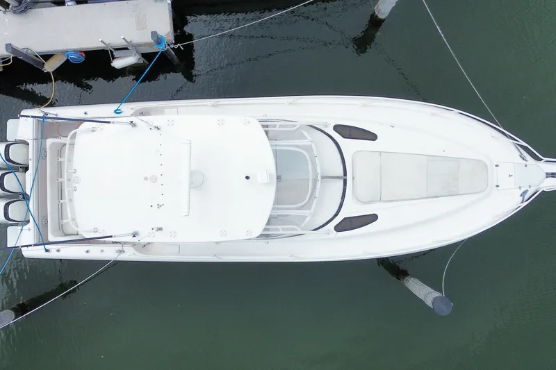 Slide: The Image of Aerial view of a 2001 Intrepid 377 Walkaround boat docked at a marina. - 54