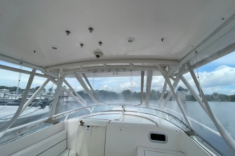 Slide: The Image of Interior view of a 2001 Intrepid 377 Walkaround boat with clear windows and seating. - 35