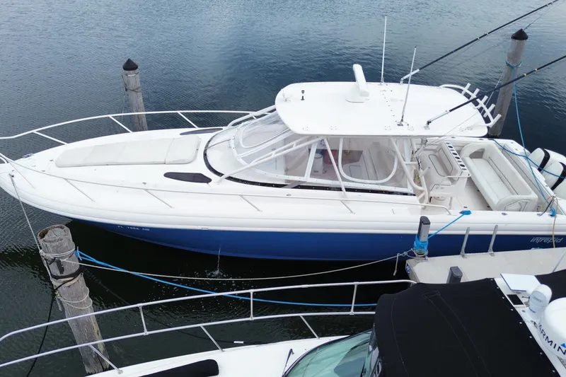 Slide: The Image of 2001 Intrepid 377 Walkaround boat docked in marina, aerial view. - 1