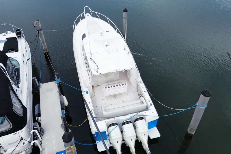 Slide: The Image of Overhead view of a 2001 Intrepid 377 Walkaround boat docked at a marina. - 51
