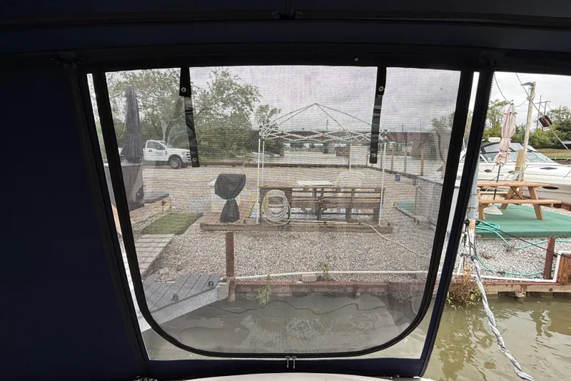 Slide: The Image of View from 2000 Sea Ray 340 Sundancer boat, overlooking marina and dock area. - 16