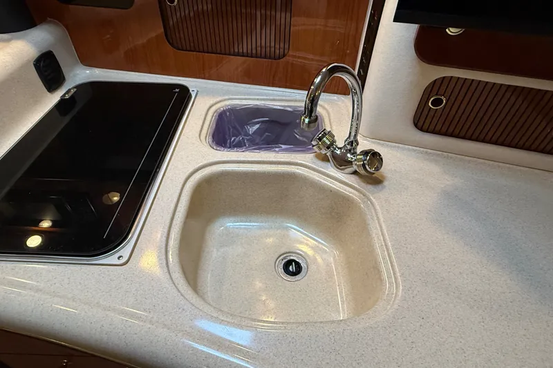 Slide: The Image of Kitchen sink and faucet on 2000 Sea Ray 340 Sundancer yacht. - 39