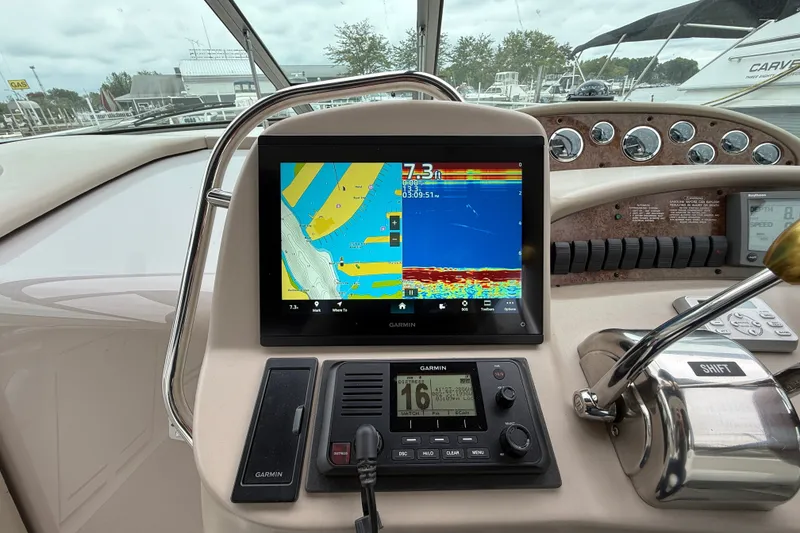Slide: The Image of Cockpit of 2000 Sea Ray 340 Sundancer with Garmin navigation display and controls. - 30