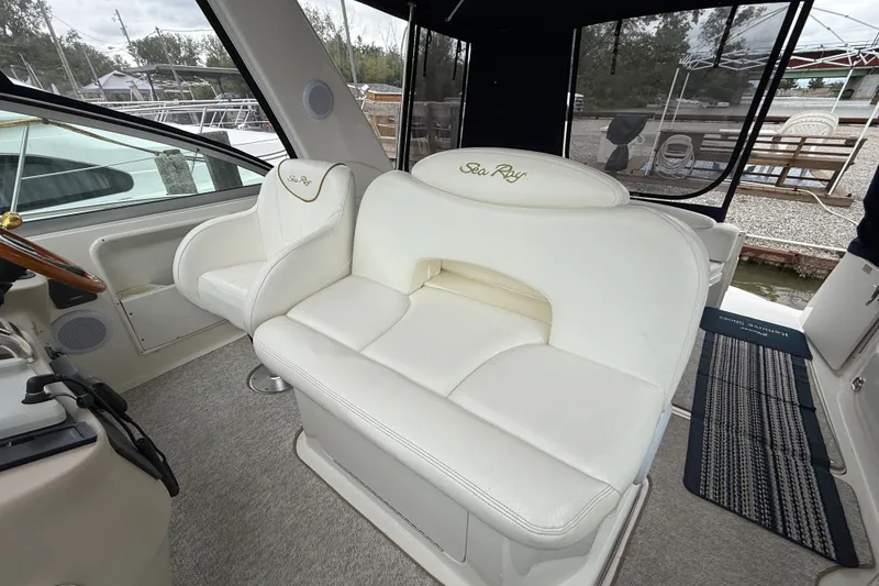 Slide: The Image of Interior of a 2000 Sea Ray 340 Sundancer boat with white leather seating. - 21
