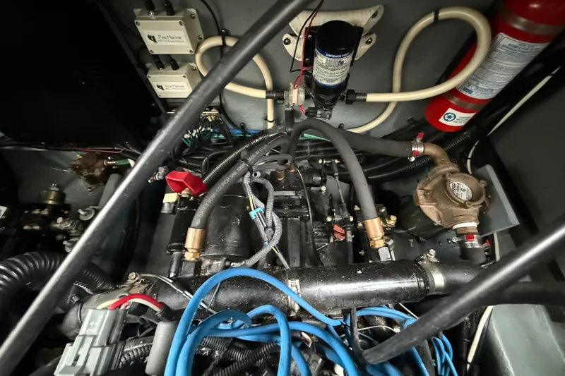 Slide: The Image of Engine compartment of a 2000 Sea Ray 340 Sundancer with visible wiring and components. - 63