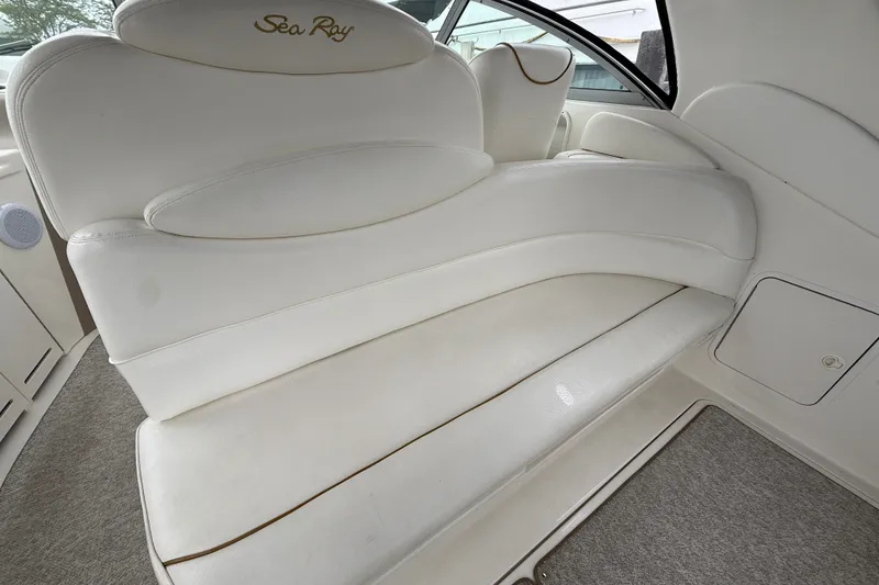 Slide: The Image of Luxurious white seating on a 2000 Sea Ray 340 Sundancer boat interior. - 11