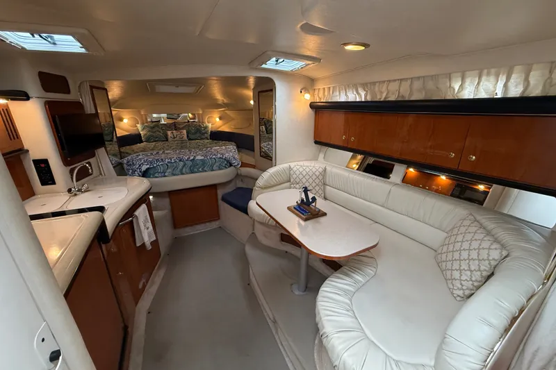 Slide: The Image of Luxurious interior of 2000 Sea Ray 340 Sundancer yacht with cozy seating and elegant decor. - 31
