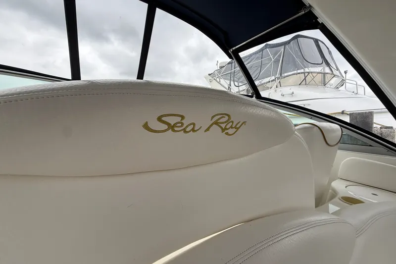Slide: The Image of Interior view of a 2000 Sea Ray 340 Sundancer boat with branded seating. - 13