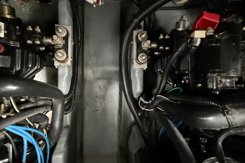 Slide: The Image of Engine compartment of a 2000 Sea Ray 340 Sundancer boat, showcasing mechanical components. - 68