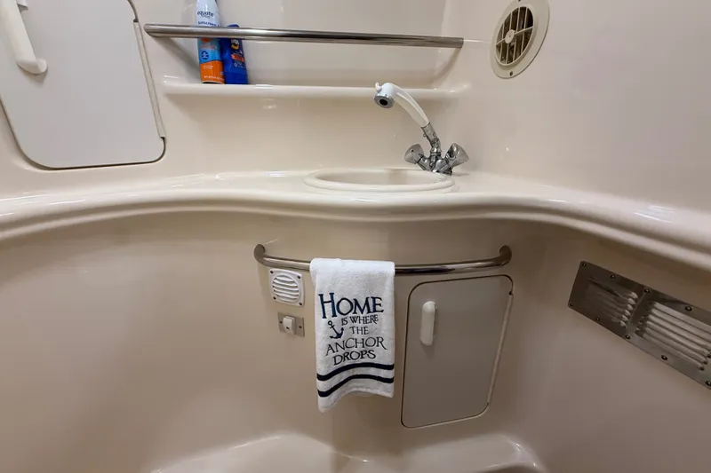 Slide: The Image of Interior of 2000 Sea Ray 340 Sundancer boat bathroom with sink and towel. - 55