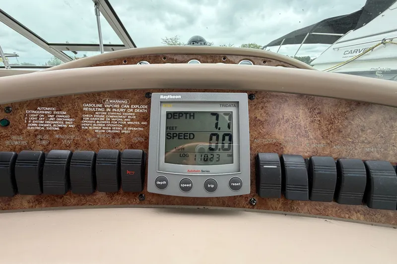 Slide: The Image of Control panel of a 2000 Sea Ray 340 Sundancer boat with depth and speed display. - 28