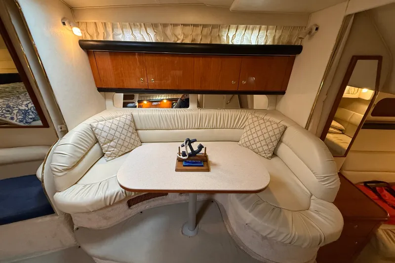 Slide: The Image of Interior of 2000 Sea Ray 340 Sundancer with cozy seating and elegant wood cabinetry. - 33