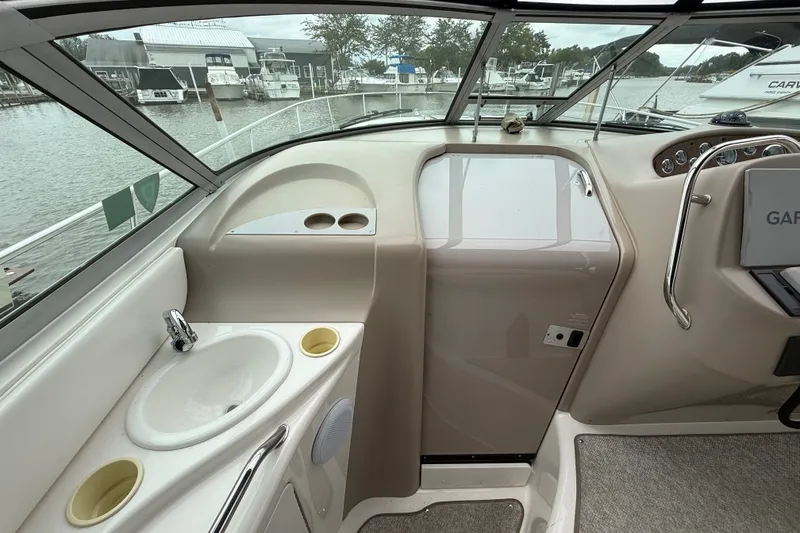 Slide: The Image of Interior view of a 2000 Sea Ray 340 Sundancer boat with sink and helm. - 20