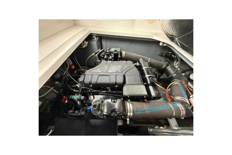 Slide: The Image of Engine compartment of a 2000 Sea Ray 340 Sundancer boat, showcasing detailed components. - 59