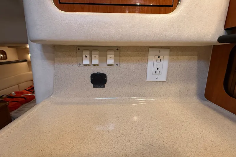 Slide: The Image of Electrical panel and outlet in 2000 Sea Ray 340 Sundancer cabin interior. - 42
