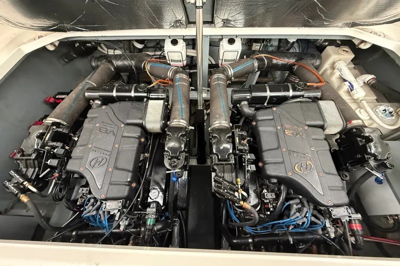 Slide: The Image of Engine compartment of a 2000 Sea Ray 340 Sundancer with dual V8 engines. - 58